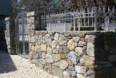 fieldstone-wall-with-metal-fence